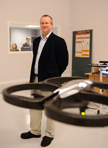 Picture of Professor Jon Timmis with a flying robot who gave a Roundhouse lecture on robotics in January 2012
