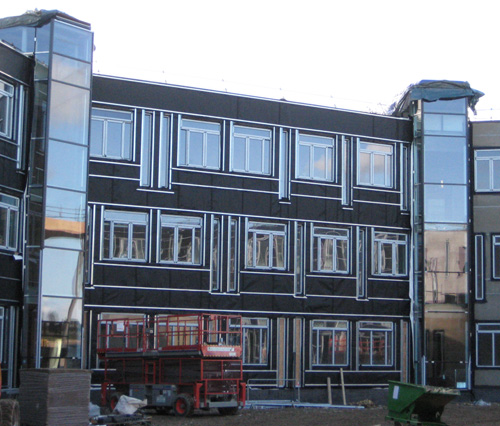 View of CS building showing full height windows covering all floors kitchen and break out areas February 2010